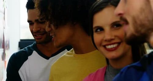 Diverse Young Adults Collaborating in an Office Setting