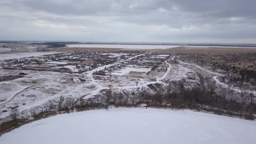 Winter Village And Strormy Clouds