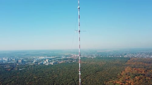 Aerial View of Radio Tower in City and Forest