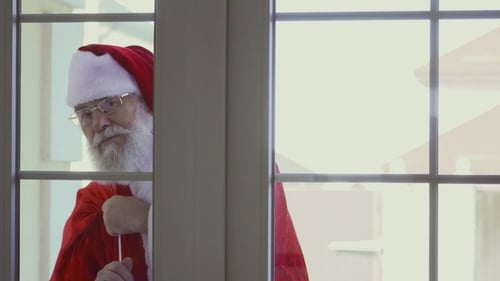 Santa Claus Knocking in Window
