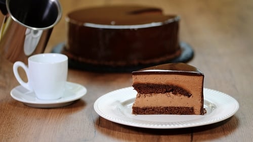 Pouring Coffee Next to Delicious Chocolate Cake