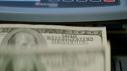 Dollar Bills Counted by Machine Close Up