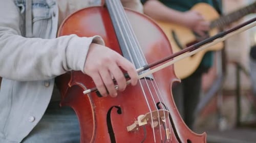 Musician Plays Cello Outdoors