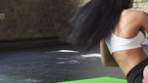 Woman Doing Core Workout with Medicine Ball