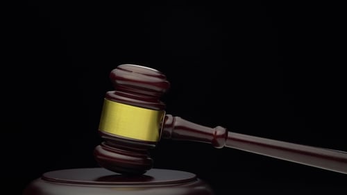 Wooden Judge's Hammer on the Stand