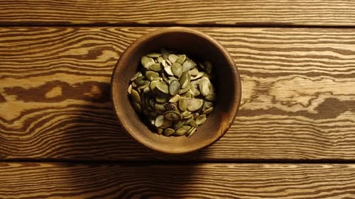 Adding Pumpkin Seeds to Bowl Time Lapse
