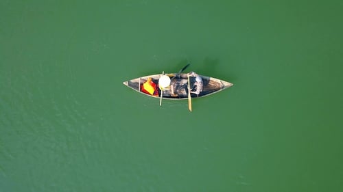 Man and Woman Riding in Boat on Lake During Summer Holiday
