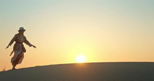 Cheerful Woman Running Barefoot on Sand Dune