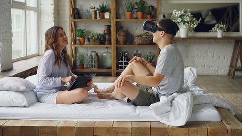 Young Couple Experiencing Virtual Reality Technology