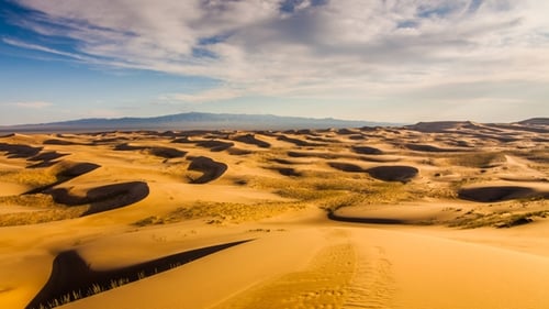 Sunset Over the Sand Dunes in the Desert