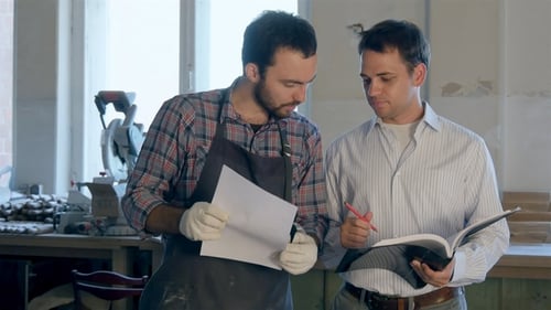 The Carpenter and His Boos Discussing Drawings in Workshop.