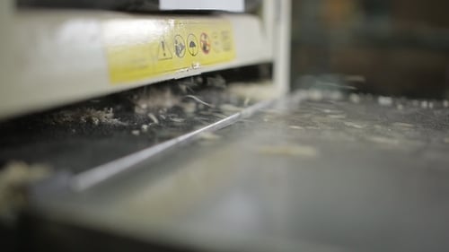 Woodworking Machine Planing Wood in Close Up
