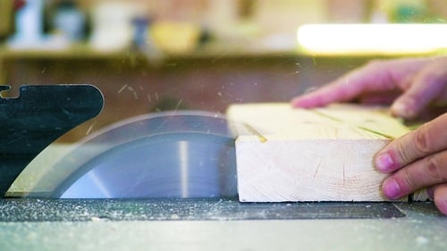 Man Working on a Saw