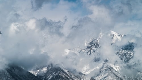 , Winter Mountains Covered with Snow in a Mist