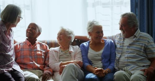 Cheerful Seniors Enjoying Friendship and Conversation