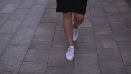 Businesswoman Walks on the Street