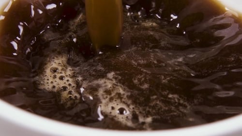 Coffee Pouring into Mug in Close-Up