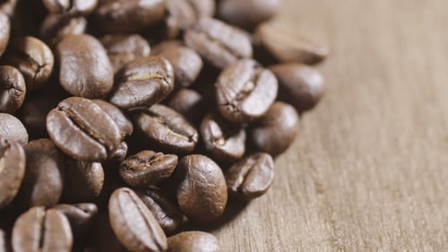 Close Up of Roasted Coffee Beans on Wood