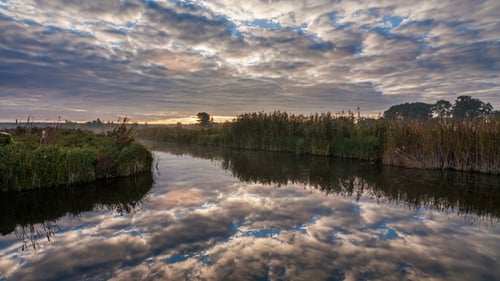 Lake in Spring at Dawn Reflection of Clouds in Water