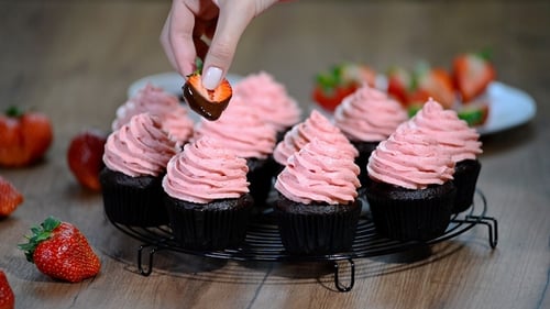 Chocolate Cupcakes Decorated with Strawberries Close Up