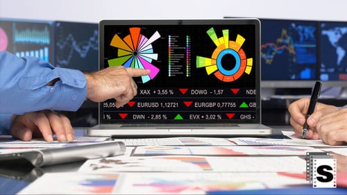 Financial Analysts Reviewing Data at Modern Workplace