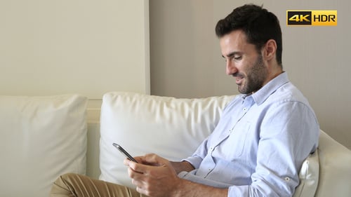 Man Texting On Smartphone