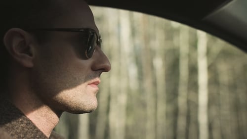 Man Driving Car on the Road Serious Success Face