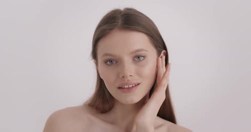 Woman Touching Face for Skincare Beauty Treatment