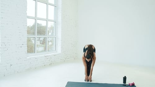 Beautiful Girl Wearing Sport at Background Near Big Windows
