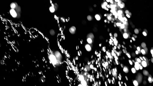 Flowing Glistening Water on Dark Background