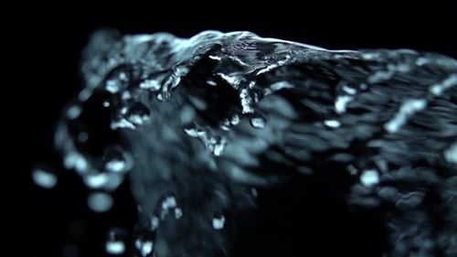 Abstract Liquid Water Flowing on Black Background