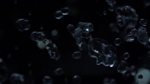 Abstract Water Droplets Sparkling on Black Background