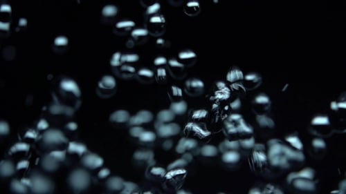 Bubbles Rising Slowly in Dark Liquid