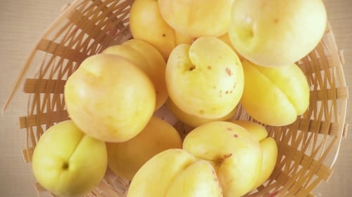 Overhead View of Apricots in Wicker Basket