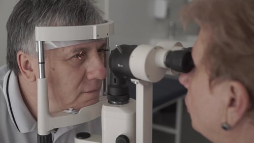 Doctor Check the Eyesight of Adult Man with Modern Equipment