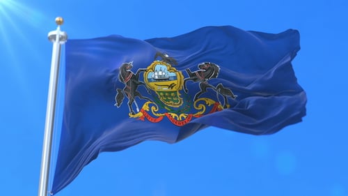 Realistic Pennsylvania State Flag Waving Against Blue Sky