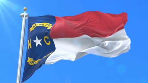 North Carolina State Flag Waving in Realistic Slow Motion with Blue Sky