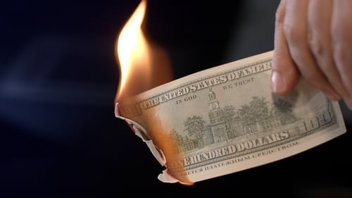 Male Hand Burning Dollar Banknote. Man Burning Money Cash. Financial Crisis