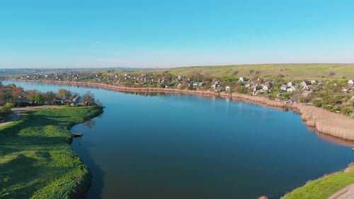 Aerial View of Country Houses on the Hill on Shore of the Pond in the Morning