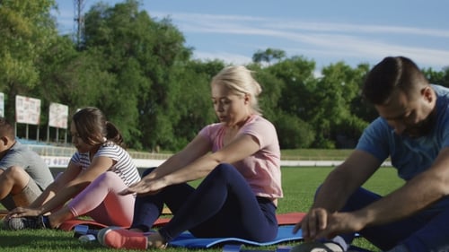 Family Working Out Together on Stadium