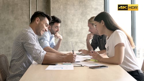 Business Team Discussing Documents in a Meeting