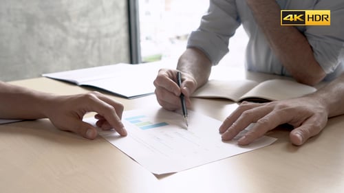 Business Colleagues Reviewing Documents in Office