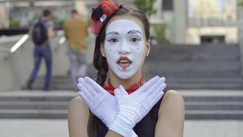 Woman Mime Making Facial Expressions on City Street