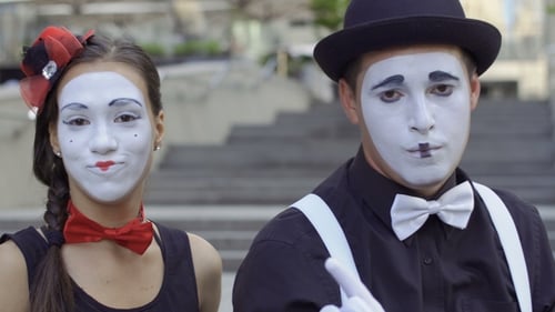 Mimes Making Gestures Outside in Urban Setting