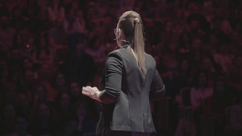 Speaker Addresses Crowd at a Corporate Event