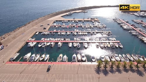 Flying Above Boats And Yachts In Port