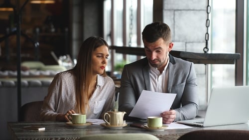 Professionals Working Together at an Urban Cafe