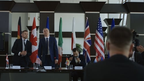 International Delegates Shake Hands in Formal Meeting