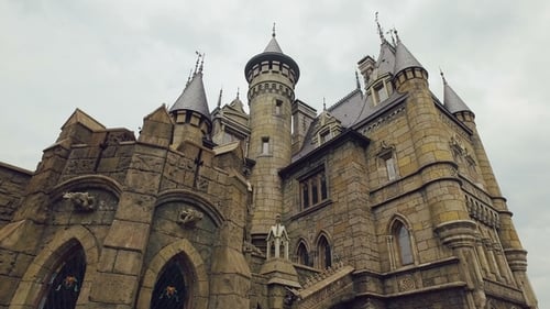 Towers of Medieval Castle, Bas-reliefs, Stone Walls, Stained Windows, Gothic Style in Architecture
