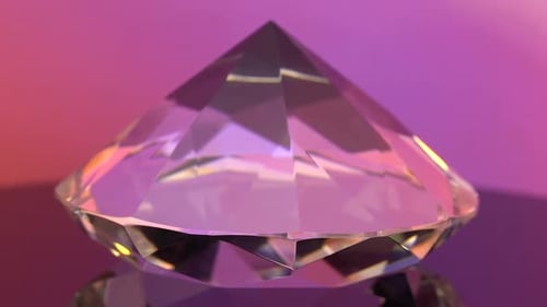 Crystal Clear Brilliant Cut Diamond Standing on Its Point Rotates